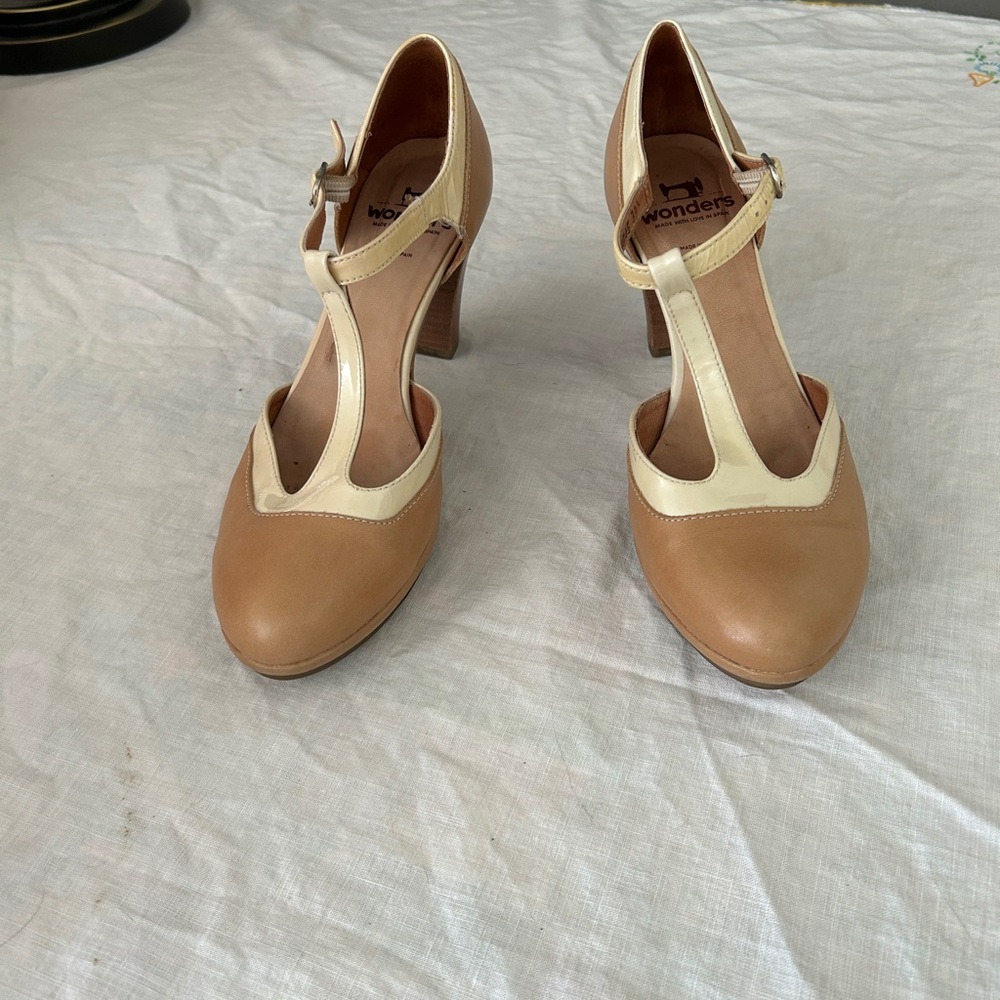 Two-tone Wonders t-strap heels.
